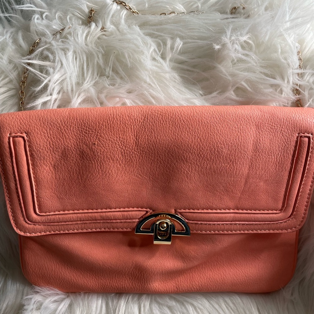 Used peach color shoulder bag with Gold chain.
